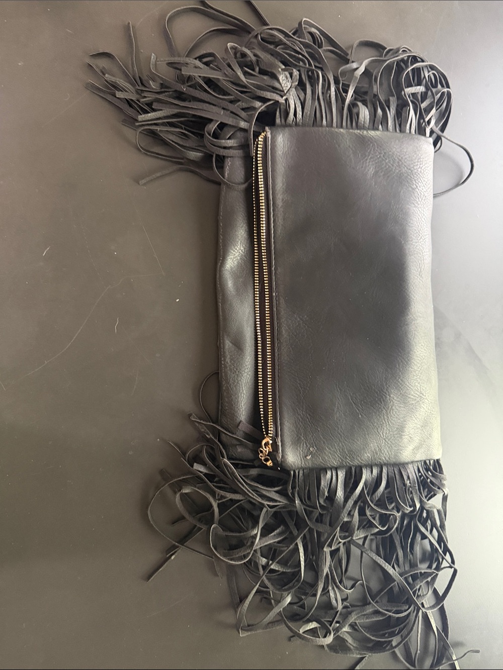 Black Leather Fringe Wristlet Clutch with Gold Zip comes with a attachable gold